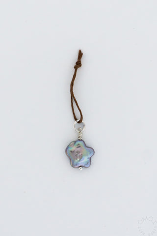 Star-shaped pearl charm pendant on thin cord, iridescent pink and blue