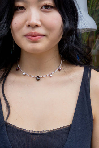 Silver bead and teardrop necklace with dark drop pendant and small colored beads