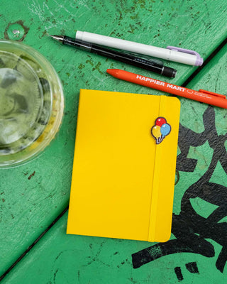 Yellow A6 weekly block planner with balloon charm and pen set