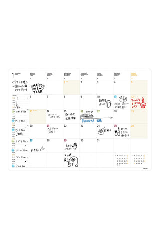 Year planner page with monthly grid, icons, and colorful date details