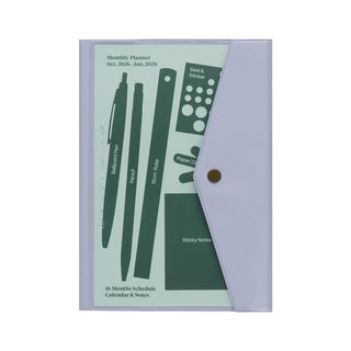 A5 monthly planner with navy cover and green pattern, secured with a button tab