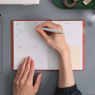 HIGHTIDE weekly block planner open with calendar grid and notes pages