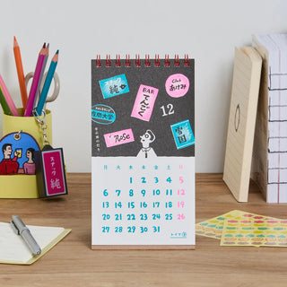 Desk calendar for month 12 with colorful note-style icons and date grid