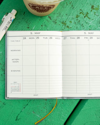 Open weekly planner page with time blocks and May 2027 date grid