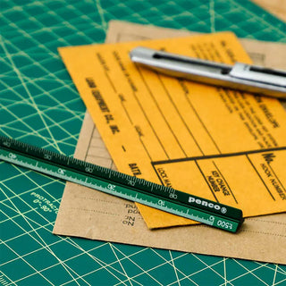 Yellow aluminum metric drafting scale with black measurement markings