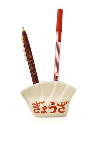 Porcelain dumpling pen holder holding two pens, cream white with red Japanese characters