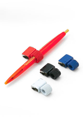 Red slide clip pen holder with clip pieces and matching pen.