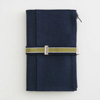 Navy fabric book cover with wide adjustable striped band and silver metal clasps