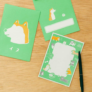 Green retro letter set cards with animal silhouettes and blank message label