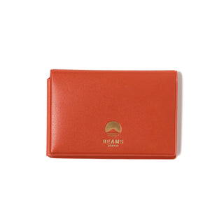 Orange card case with BEAMS Japan logo on front, smooth textured surface