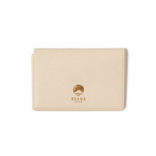 Cream card case with BEAMS Japan logo on front, smooth textured surface