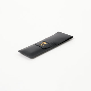 Black leather-look pen case with snap flap and small BEAMS Japan logo patch