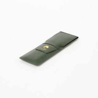 Green leather-look pen case with open snap flap and BEAMS Japan logo patch