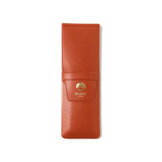 Orange leather-look pen case with snap front and BEAMS Japan logo badge