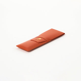 Terracotta leather-look pen case with BEAMS logo on front snap flap.