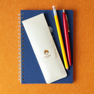White leather-look pen case with BEAMS logo, shown with pens on top.