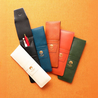 Set of leather-look pen cases in multiple colors with BEAMS logo patches.