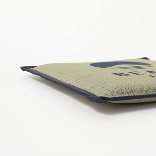 Light cushion corner with navy piping and neatly folded edge