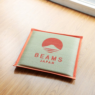 Hagihara x BEAMS Japan cushion in orange: square woven cover with BEAMS JAPAN text and logo