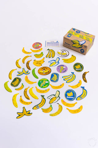 Banana-themed seal stickers scattered, colorful fruit icons and labels