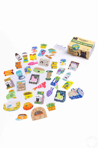 Hako seal sticker box with assorted stickers spread out across the table.