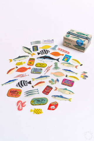 Mixed seafood seal stickers scattered, colorful fish and accessory icons