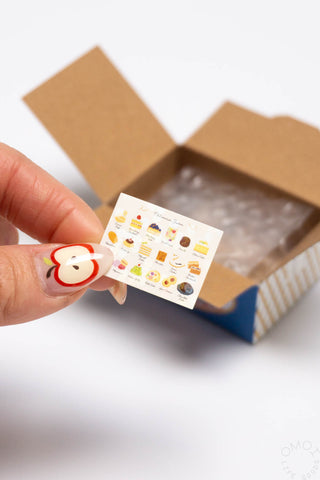 Sticker seal box with small food icon seal sticker; kraft and blue box