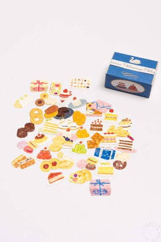 Sticker seal box with assorted food-themed stickers and blue label box