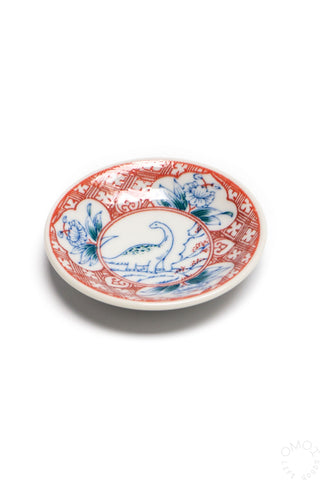 Porcelain mini plate with red and blue dinosaur motif and decorated rim