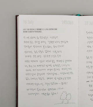 Brown diary notebook open to handwritten letter pages dated July