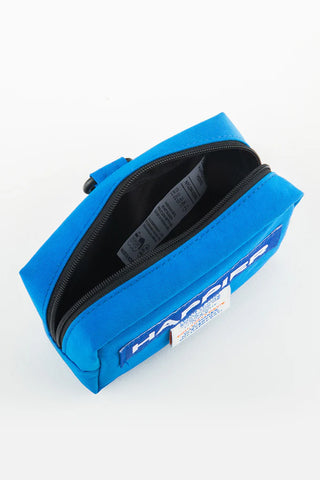Blue tofu pouch open with zipper and inner label visible