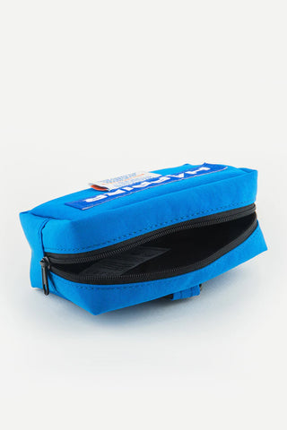 Blue tofu pouch with zipper and top panel label