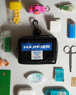 Black tofu pouch with top handle, zipper, and Happier label