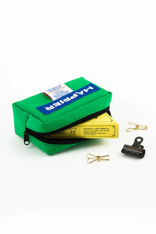 Green tofu pouch with zipper top and Happier label