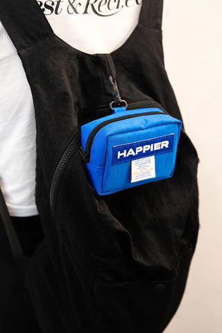 Blue Happier label tofu pouch worn on the chest with zipper