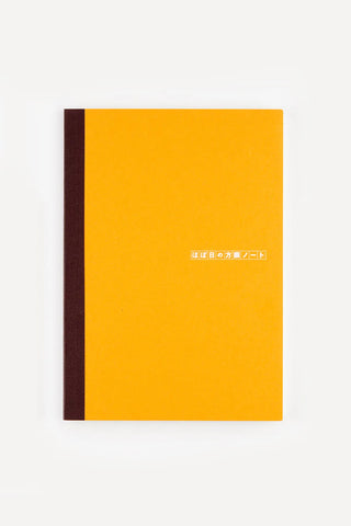 A5 graph notebook with orange cover and dark spine stripe