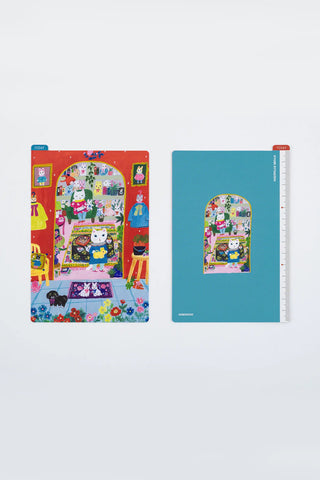Hobonichi A6 pencil board with colorful Yumi Kitagishi character scene, blue background