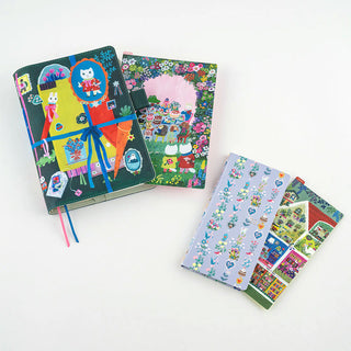 Colorful illustrated pencil boards featuring animals and houses, shown folded and stacked