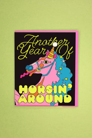 Unicorn birthday card with 'Another Year Of' and 'HORSIN' AROUND' text