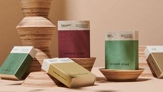 Rosemary incense boxes with wooden holders and surrounding packaging