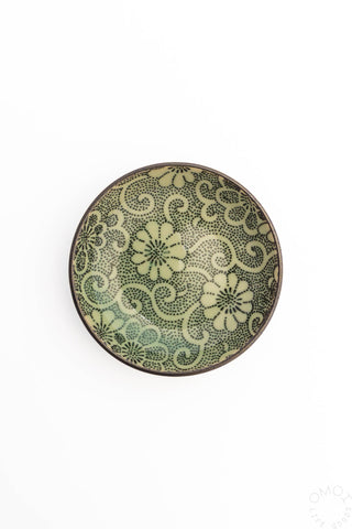 Small round ceramic sauce dish with green floral decorative pattern
