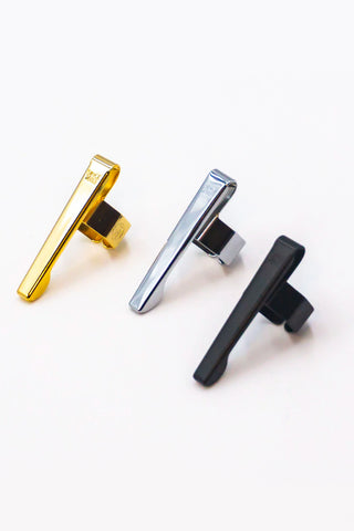 Set of three pen clips: gold, chrome, and black, each with hinged clasp