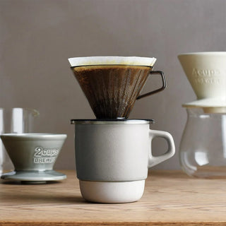Stacking ceramic coffee mug with white base and dripper sitting on top