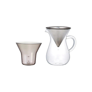 Two coffee carafes: clear glass pour cone with handle and matching cup