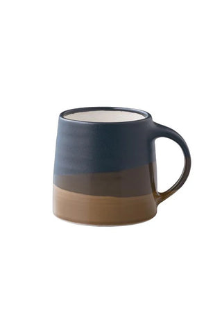 Two-tone ceramic coffee mug with dark blue top and brown base, curved handle