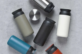 Assorted 500ml travel tumblers with black lids in multiple colors