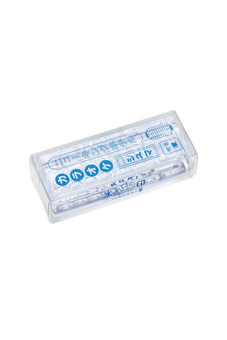 Clear long stamp with blue characters in a transparent case