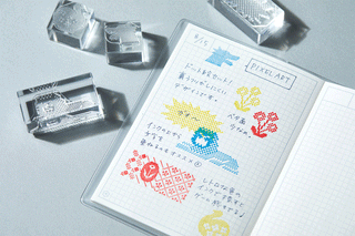 Clear stamp set creating pixel-art dot designs on graph paper sample motifs