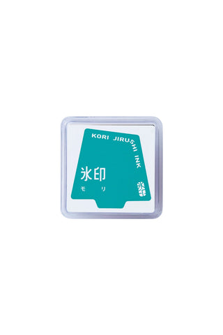 Clear plastic ink stamp pad with teal KORI JIRUSHI label and dark teal pad