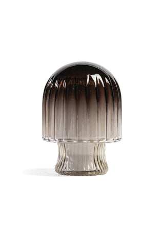 Mushroom-shaped candle cloche with dark dome lid and clear glass base